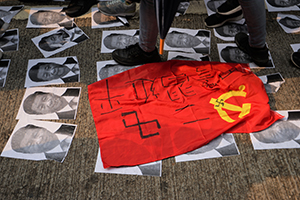 Photos of Xi Jinping and a communist flag on the ground, global anti-totalitarianism march, Hennessy Road, Wanchai, 29 September 2019