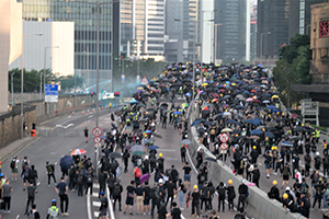 Protesters on Harcourt Road flyover facing water cannon jets and tear gas, Admiralty, 1 October 2019