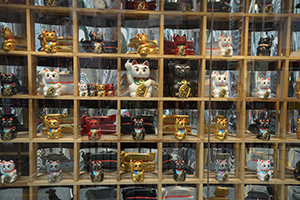 Japanese good luck welcoming cats (Maneki-neko) on display in the window of G.O.D., Hong Kong Island, 27 October 2019