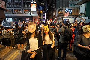 Masked protesters on Wellington Street, Central, 31 October 2019