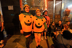 Filipino Halloween revellers with matching pumpkin costumes, Pottinger Street, Central, 31 October 2019