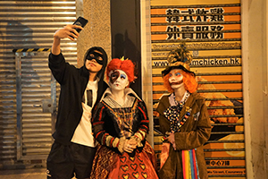 Halloween revellers taking a selfie, Wyndham Street, 31 October 2019