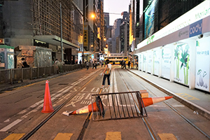 Barricade on Des Voeux Road Central, street protest against the anti-mask law due to come into force at midnight, 4 October 2019