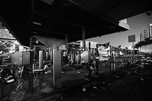 The vandalized and burnt toll plaza of the Cross-harbour tunnel, blocked to traffic by protesters, Hong Chong Road, Hung Hom, 16 November 2019