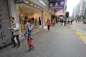 People covering their faces due to fear of tear gas residue, Nathan Road, Kowloon, 19 November 2019