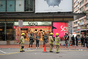 Riot police and firefighters on Kimberley Road, Tsim Sha Tsui, 19 November 2019