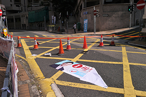 District Council election banner on the ground in front of a roadblock, Bonham Road, Sai Ying Pun, 15 November 2019