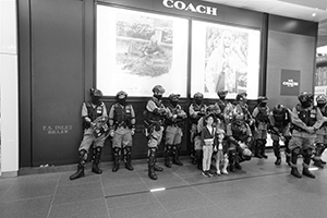 Posing for photos with police in riot gear, Canton Road, Tsim Sha Tsui, 26 December 2019