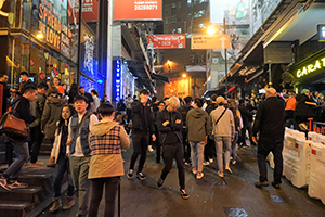 Crowds on D'Aguilar Street celebrating New Year's Eve, Central, 31 December 2019