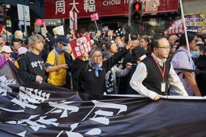 Participants carrying a banner in a protest march from Causeway Bay to Central, Hennessy Road, 8 December 2019