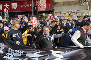 Participants carrying a banner in a protest march from Causeway Bay to Central, Hennessy Road, 8 December 2019