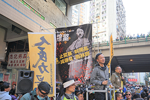 Raymond Chan Chi-chuen addressing marchers during a protest march from Causeway Bay to Central, Hennessy Road, 8 December 2019