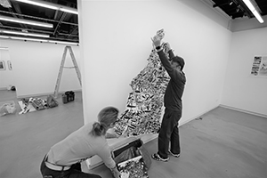 Artist Chak installing an artwork by Kwok Mang Ho in the Visual Arts Centre, Kennedy Road, 11 December 2019