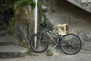 Bicycle parked on a hillside path above Yung Shue Wan, Lamma Island, 15 December 2019