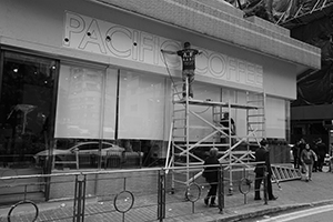 Workers installing a sign for a new branch of Pacific Coffee, Morrison Street, Sheung Wan, 17 December 2019