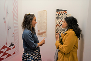 New Zealand Maori artist Nikau Hindin (left), in front of her work,  at the opening of 'Koloa: Women, Art, and Technology', Para Site, King's Road, Quarry Bay, 6 December 2019