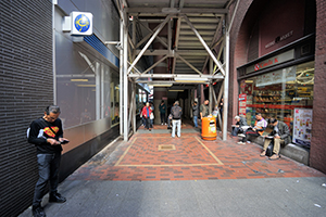 Outside a Jockey Club off-course betting branch on a day of horse racing at Shatin, Sheung Wan, 21 December 2019