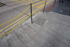 Yellow chains replacing railings, and graffiti placed in wet concrete, Jordan, 22 December 2019