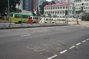 Graffiti on the ground, Cheong Wan Road, Hung Hom, 22 December 2019