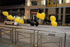 Balloons on a railing, Queen's Road East,  Wanchai,  1 January 2020