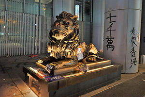 A vandalized lion sculpture outside the Hong Kong Bank Building, Des Voeux Road Central, 1 January 2020