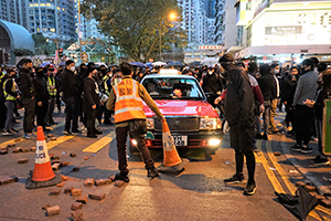 A taxi stalled by a roadblock, Luard Road, Wanchai, 1 January 2020