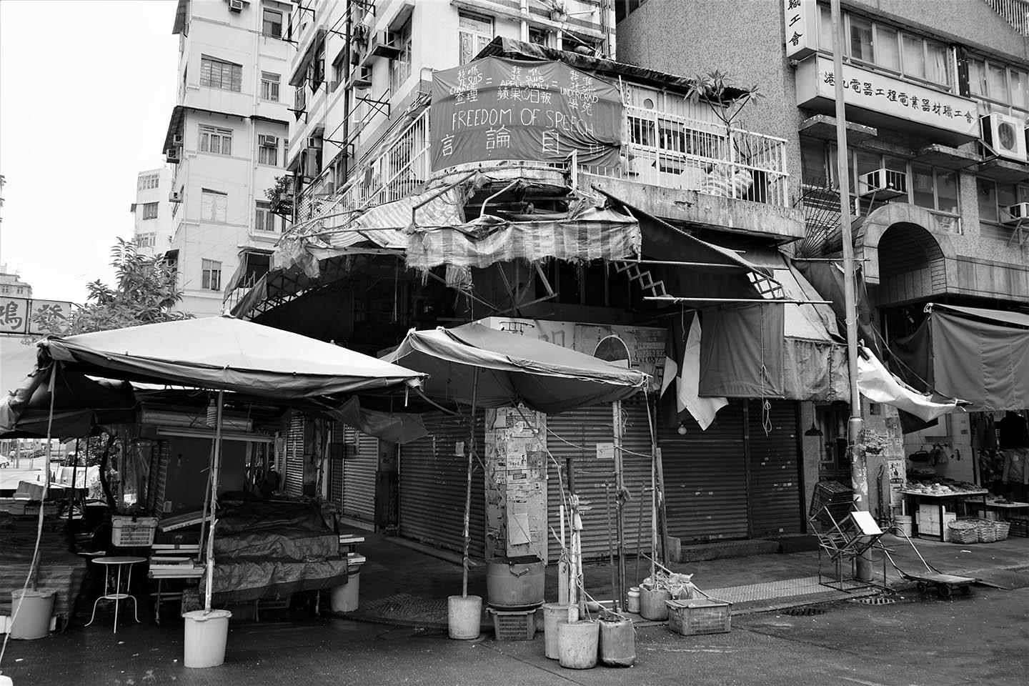 A freedom of speech banner tied to the fence of the balcony of a ...