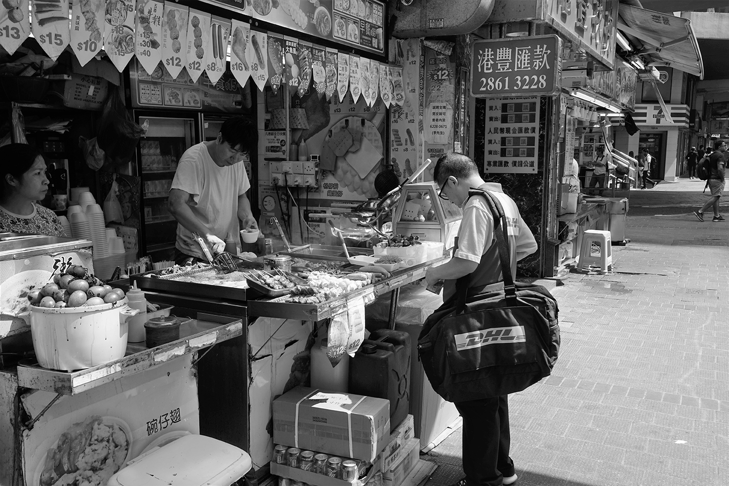 DHL worker buying street food, Lockhart Road, Wanchai, Hong Kong Island ...